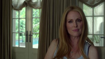 Movie still from “Maps to the Stars” (2014), directed by David Cronenberg – A person sitting in a room; Close Up shot, Over the shoulder angle