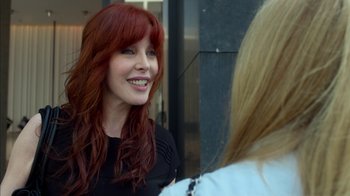 Movie still from “Maps to the Stars” (2014), directed by David Cronenberg – A woman with long red hair talking to another woman; Close Up shot, Over the shoulder angle