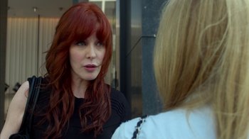 Movie still from “Maps to the Stars” (2014), directed by David Cronenberg – A woman with long red hair talking to another woman; Close Up shot, Over the shoulder angle