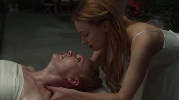 Movie still from “Maps to the Stars” (2014), directed by David Cronenberg – A man and a woman laying on a bed; Close Up shot, Overhead angle