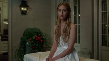 Movie still from “Maps to the Stars” (2014), directed by David Cronenberg – A beautiful young lady in a white dress; Medium shot, Over the shoulder angle