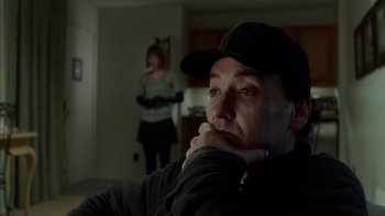 Movie still from “Maps to the Stars” (2014), directed by David Cronenberg – A man and a woman in a living room; Close Up shot, Over the shoulder angle