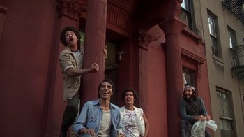Movie still from “Marathon Man” (1976), directed by John Schlesinger – A group of men standing next to each other on the side of a building; Medium shot, Low angle