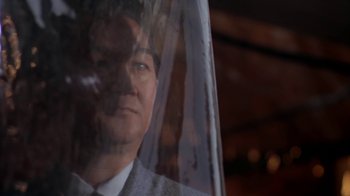 Movie still from “Marathon Man” (1976), directed by John Schlesinger – A man wearing a suit and tie standing next to a window; Close Up shot, Low angle
