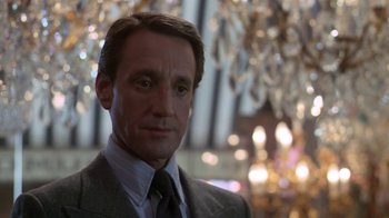 Movie still from “Marathon Man” (1976), directed by John Schlesinger – A person wearing a suit and tie; Close Up shot, Low angle