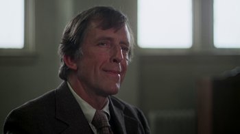 Movie still from “Marathon Man” (1976), directed by John Schlesinger – A person wearing a suit and tie; Close Up shot, Low angle