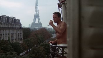 Movie still from “Marathon Man” (1976), directed by John Schlesinger – A shirtless man eating a sandwich on the balcony of a hotel room; Medium shot, Low angle
