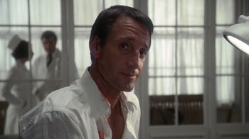 Movie still from “Marathon Man” (1976), directed by John Schlesinger – A person wearing a white shirt; Close Up shot, Over the shoulder angle