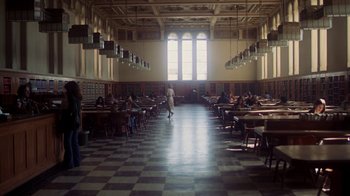 Movie still from “Marathon Man” (1976), directed by John Schlesinger – People are sitting at tables in a large library; Extreme Wide shot, High angle