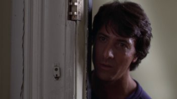 Movie still from “Marathon Man” (1976), directed by John Schlesinger – A man standing in front of a white door; Close Up shot, Low angle