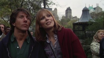 Movie still from “Marathon Man” (1976), directed by John Schlesinger – A woman and a man standing next to each other in a park; Close Up shot, Low angle