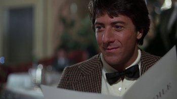 Movie still from “Marathon Man” (1976), directed by John Schlesinger – A person wearing a suit and bow tie; Close Up shot, Over the shoulder angle