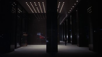 Movie still from “Marathon Man” (1976), directed by John Schlesinger – A person is walking in a dark building; Extreme Wide shot, High angle