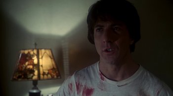 Movie still from “Marathon Man” (1976), directed by John Schlesinger – A person wearing a white shirt with blood all over it; Close Up shot, Low angle