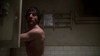Movie still from “Marathon Man” (1976), directed by John Schlesinger – A man in the shower with his hands up; Close Up shot, Low angle