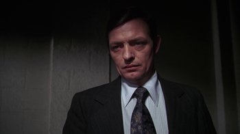 Movie still from “Marathon Man” (1976), directed by John Schlesinger – A person wearing a suit and tie; Close Up shot, Low angle
