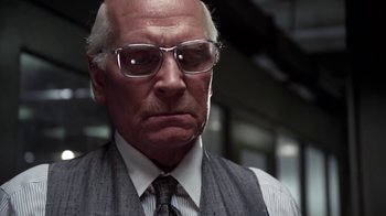Movie still from “Marathon Man” (1976), directed by John Schlesinger – An older man wearing glasses and a tie; Close Up shot, Low angle