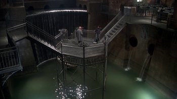 Movie still from “Marathon Man” (1976), directed by John Schlesinger – Two men standing on top of a metal structure; Extreme Wide shot, High angle