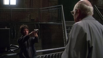 Movie still from “Marathon Man” (1976), directed by John Schlesinger – A man taking a picture of himself in a mirror; Medium shot, Over the shoulder angle