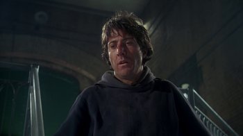 Movie still from “Marathon Man” (1976), directed by John Schlesinger – A man in a hooded sweatshirt looking down; Close Up shot, Low angle