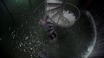 Movie still from “Marathon Man” (1976), directed by John Schlesinger – A spiral staircase in the middle of a body of water; Extreme Wide shot, Overhead angle
