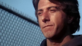 Movie still from “Marathon Man” (1976), directed by John Schlesinger – A man's face in front of a chain link fence; Close Up shot, Low angle