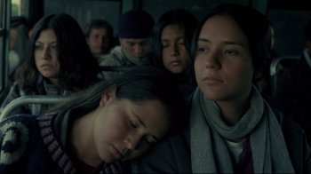 Movie still from “Maria Full of Grace” (2004), directed by Joshua Marston – A group of people sitting on a train; Close Up shot, High angle