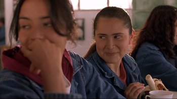 Movie still from “Maria Full of Grace” (2004), directed by Joshua Marston – A woman sitting next to another woman in front of a window; Close Up shot, Over the shoulder angle