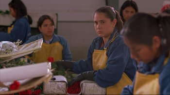 Movie still from “Maria Full of Grace” (2004), directed by Joshua Marston – A group of people sitting around a table; Close Up shot, Over the shoulder angle