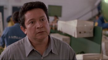 Movie still from “Maria Full of Grace” (2004), directed by Joshua Marston – A person wearing a gray shirt; Close Up shot, Over the shoulder angle