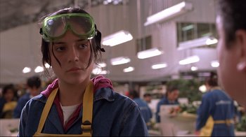 Movie still from “Maria Full of Grace” (2004), directed by Joshua Marston – A woman wearing goggles and a blue jacket; Close Up shot, Low angle