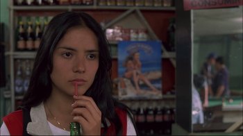 Movie still from “Maria Full of Grace” (2004), directed by Joshua Marston – A woman holding a bottle and drinking a beer; Close Up shot, Over the shoulder angle