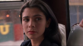 Movie still from “Maria Full of Grace” (2004), directed by Joshua Marston – A person with long black hair; Close Up shot, Over the shoulder angle