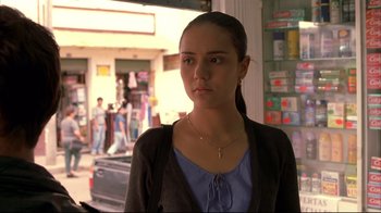 Movie still from “Maria Full of Grace” (2004), directed by Joshua Marston – A woman standing in front of a store window; Close Up shot, Over the shoulder angle