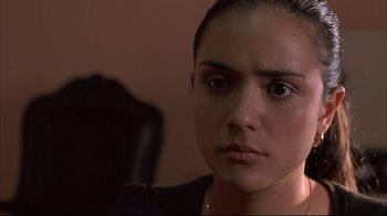 Movie still from “Maria Full of Grace” (2004), directed by Joshua Marston – A person wearing a leather jacket; Close Up shot, Low angle