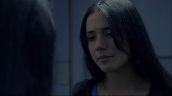 Movie still from “Maria Full of Grace” (2004), directed by Joshua Marston – A woman with long black hair stares into the mirror; Close Up shot, Over the shoulder angle