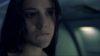 Movie still from “Maria Full of Grace” (2004), directed by Joshua Marston – A person with long black hair; Close Up shot, High angle