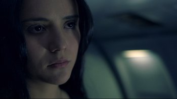 Movie still from “Maria Full of Grace” (2004), directed by Joshua Marston – A person in a car looking at the camera; Close Up shot, Low angle