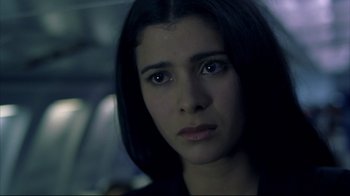 Movie still from “Maria Full of Grace” (2004), directed by Joshua Marston – A person with long black hair; Close Up shot, High angle