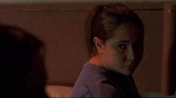 Movie still from “Maria Full of Grace” (2004), directed by Joshua Marston – A woman sitting on a couch in the dark; Close Up shot, Over the shoulder angle