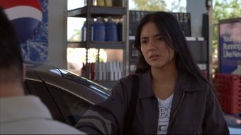 Movie still from “Maria Full of Grace” (2004), directed by Joshua Marston – A woman sitting in a car in front of a store; Close Up shot, Over the shoulder angle
