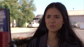 Movie still from “Maria Full of Grace” (2004), directed by Joshua Marston – A woman with long black hair standing in front of a tree; Close Up shot, Low angle