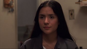 Movie still from “Maria Full of Grace” (2004), directed by Joshua Marston – A woman with long black hair is looking at the camera; Close Up shot, Low angle