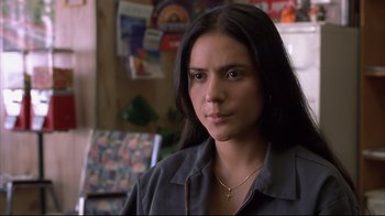 Movie still from “Maria Full of Grace” (2004), directed by Joshua Marston – A person with long black hair; Close Up shot, Over the shoulder angle