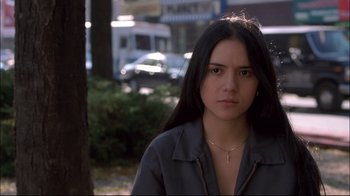 Movie still from “Maria Full of Grace” (2004), directed by Joshua Marston – A woman with long black hair is standing in the street; Close Up shot, Low angle