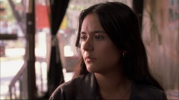 Movie still from “Maria Full of Grace” (2004), directed by Joshua Marston – A person with long dark hair; Close Up shot, Low angle