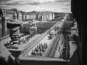 Movie still from “Marie Antoinette” (1938), directed by Julien Duvivier – A black - and - white photo of a crowd of people; Extreme Wide shot, High angle