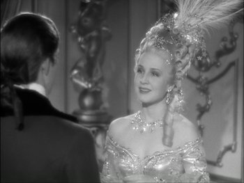Movie still from “Marie Antoinette” (1938), directed by Julien Duvivier – A man and a woman are dressed up for a formal event; Close Up shot, Over the shoulder angle