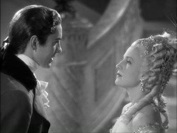 Movie still from “Marie Antoinette” (1938), directed by Julien Duvivier – A man and a woman are looking at one another; Close Up shot, Over the shoulder angle