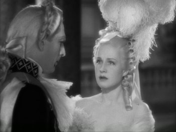 Movie still from “Marie Antoinette” (1938), directed by Julien Duvivier – A man and a woman are talking to each other; Close Up shot, Over the shoulder angle